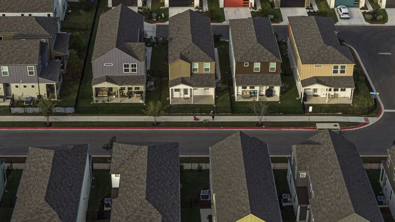 New-build Austin streets from overhead at dusk — aerial photographed for The New York Times Magazine