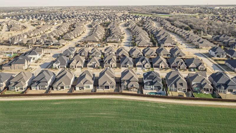 Master-planned suburb meeting open farmland — aerial photographed for The New York Times Magazine